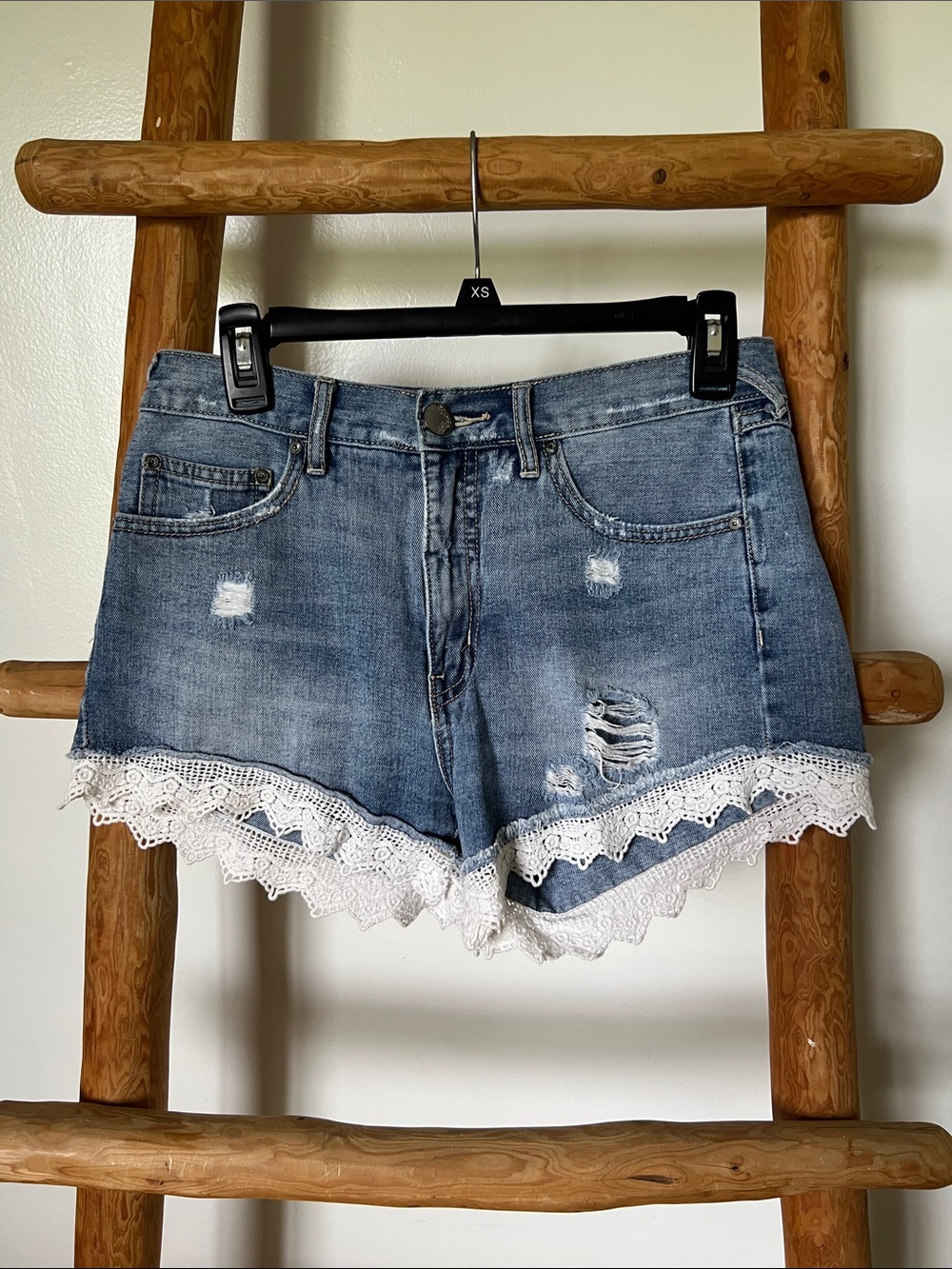 Free People Distressed Denim Shorts with White Lace Trim